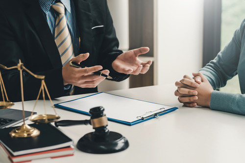 A person with an MLS talking with a client